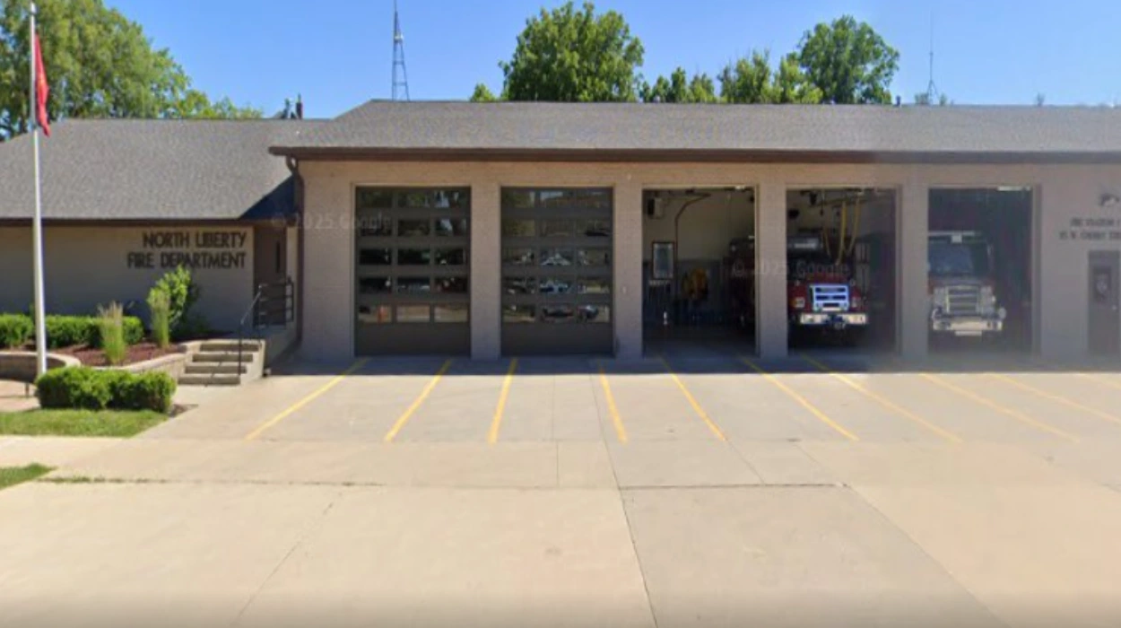 North Liberty Firefighters Battle Windswept Structure Fire in Iowa City