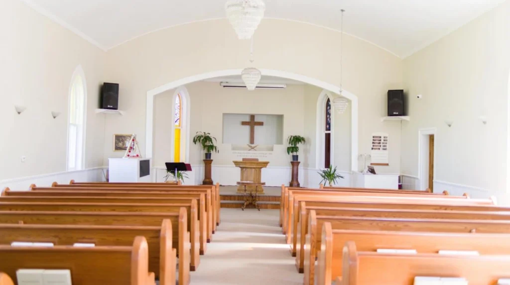 How do community churches in Rumney impact local social cohesion?